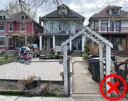 An example of incorrect vegetation shown by 1225 Hubbard in the Hubbard Farms Historic District which shows that the front lawn is taken out completely in favor of stone pavers and lawn furniture is permanently placed on the pavers as well. 