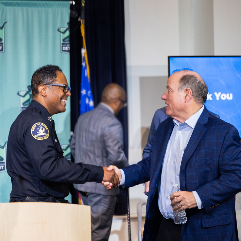 mayor and chief shaking hands